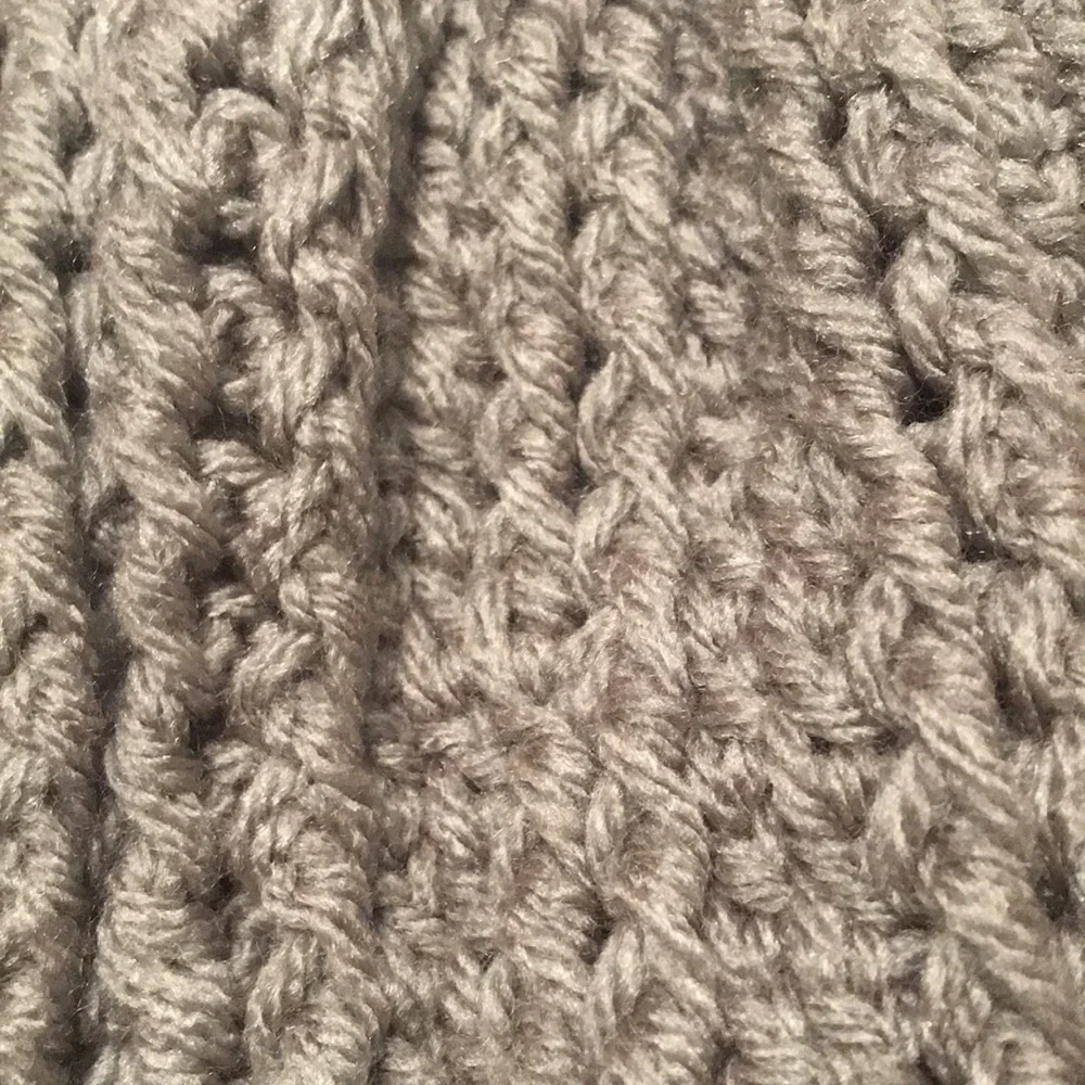 Handmade Crochet hat. Never worn. Grey in color.